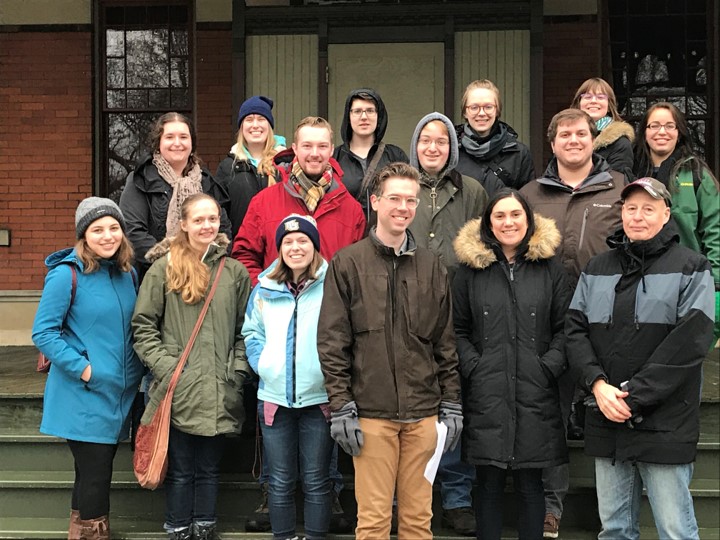 Dr. Ted Karamanski and a group of students stand in front of the entrance to Pullman National Historic Park